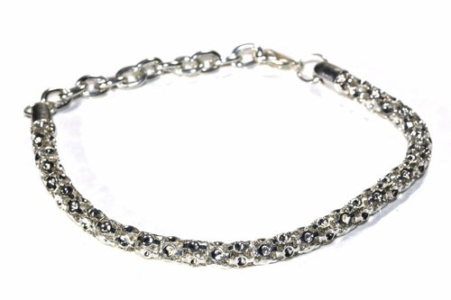 Silver Hestia Layla Flashy bracelet with sparkling design, showcasing intricate metalwork and stylish embellishments.