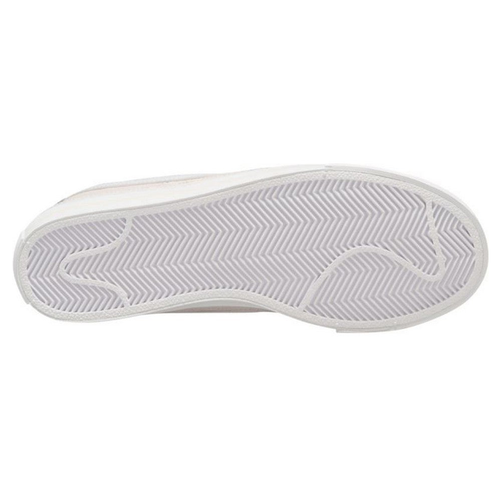 Nike Court Legacy W trainers in white and black, with classic design and Nike branding, shown on a plain background.