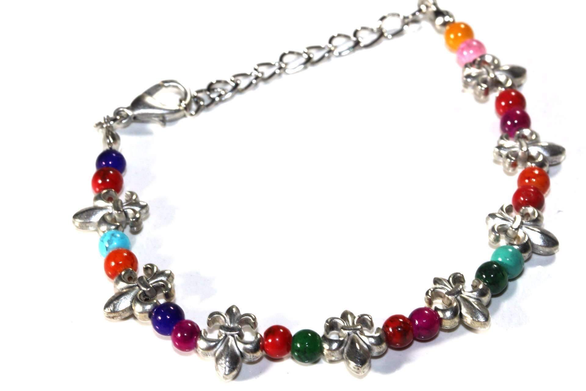 Colorful Fleur De Lis bracelet by Silver Hestia featuring vibrant beads and intricate metal charms on a flexible bracelet band.