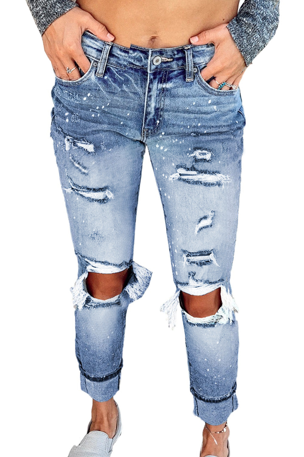 Light blue ripped straight leg jeans for women by Lavender Pallas, showing distressed denim with a relaxed fit and modern style.