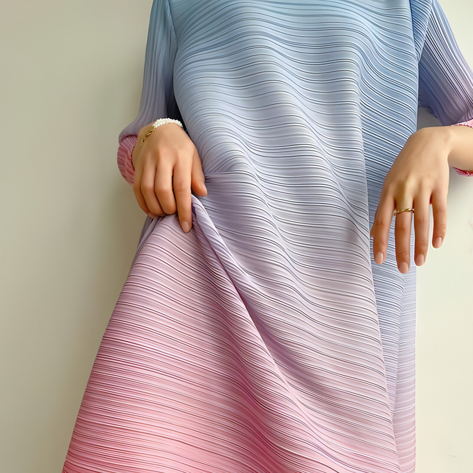 Plus size pleated dress for women by Carmine Juneberry, featuring a flowing design and elegant pleats.