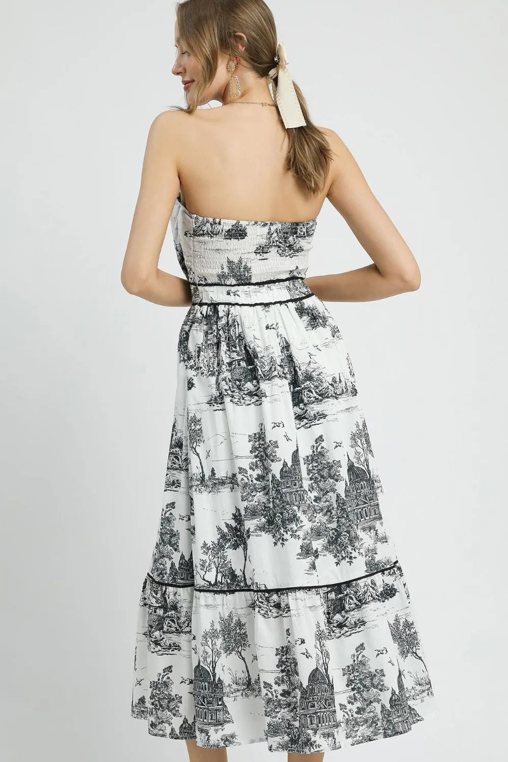 Colorful Umgee printed tiered tube midi dress with a relaxed fit, featuring a floral pattern and tiered design, ideal for casual wear.