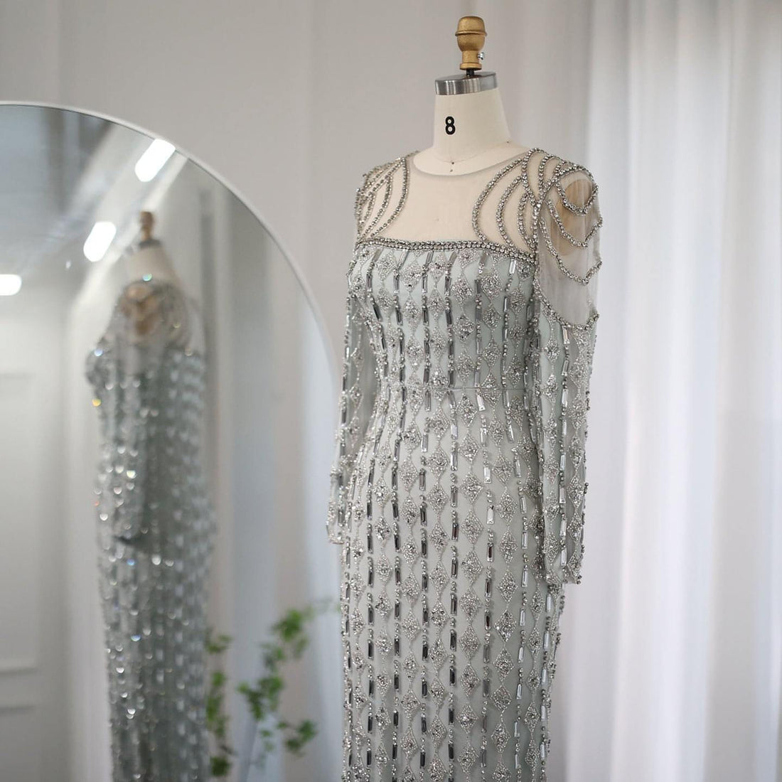 Long sleeve slim fishtail dress by Carmine Juneberry, featuring a fitted silhouette and elegant design.