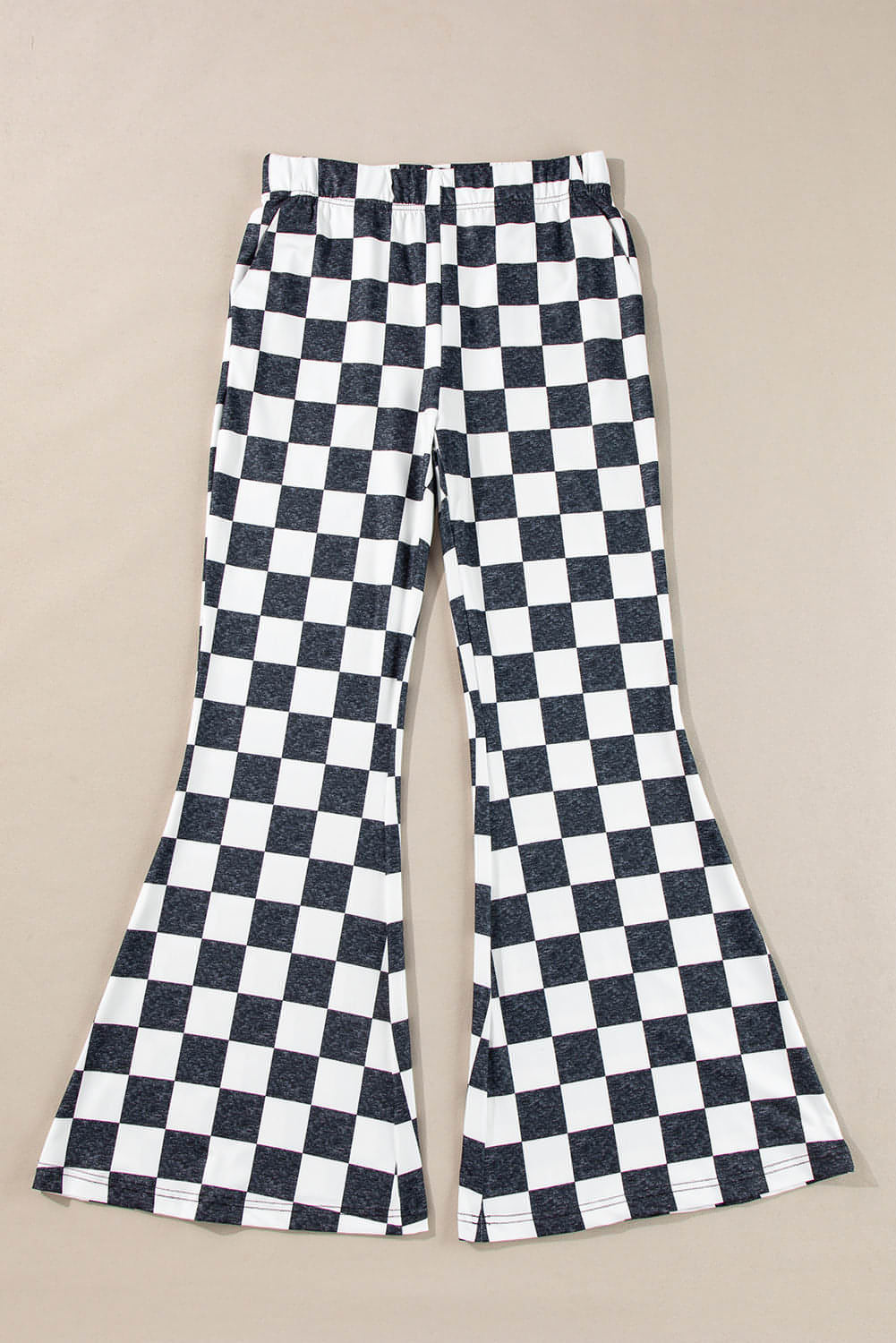 Black checkerboard high-rise casual flared pants by Carmine Juneberry, showcasing the stylish pattern and relaxed fit.