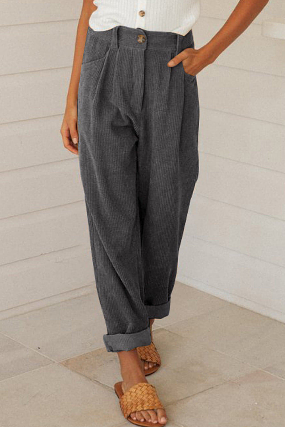 Gray corduroy high waist straight-leg pants by Carmine Juneberry, shown on a model highlighting the fit and textured fabric.