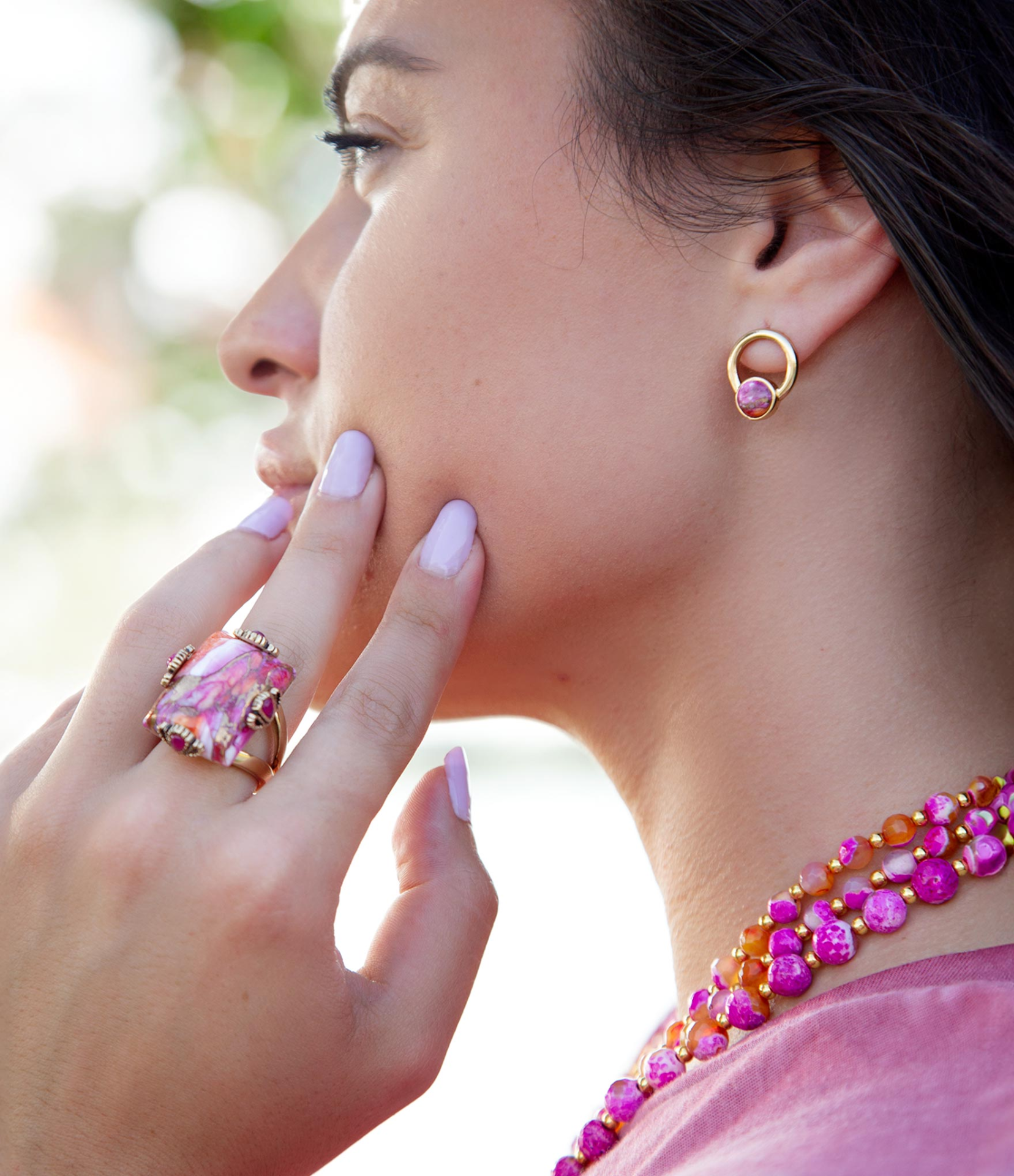 Prismatic pink spiny oyster matrix statement ring with intricate design, set in jewelry style, showcasing vibrant pink hues.