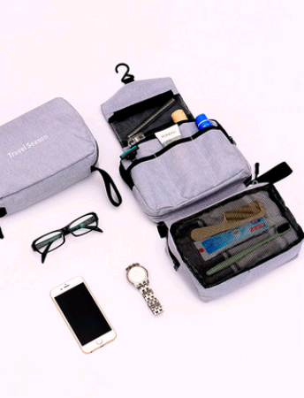 Maroon Asteria portable travel makeup bag with a multifunction hook, compact and ideal for organizing cosmetics on the go.