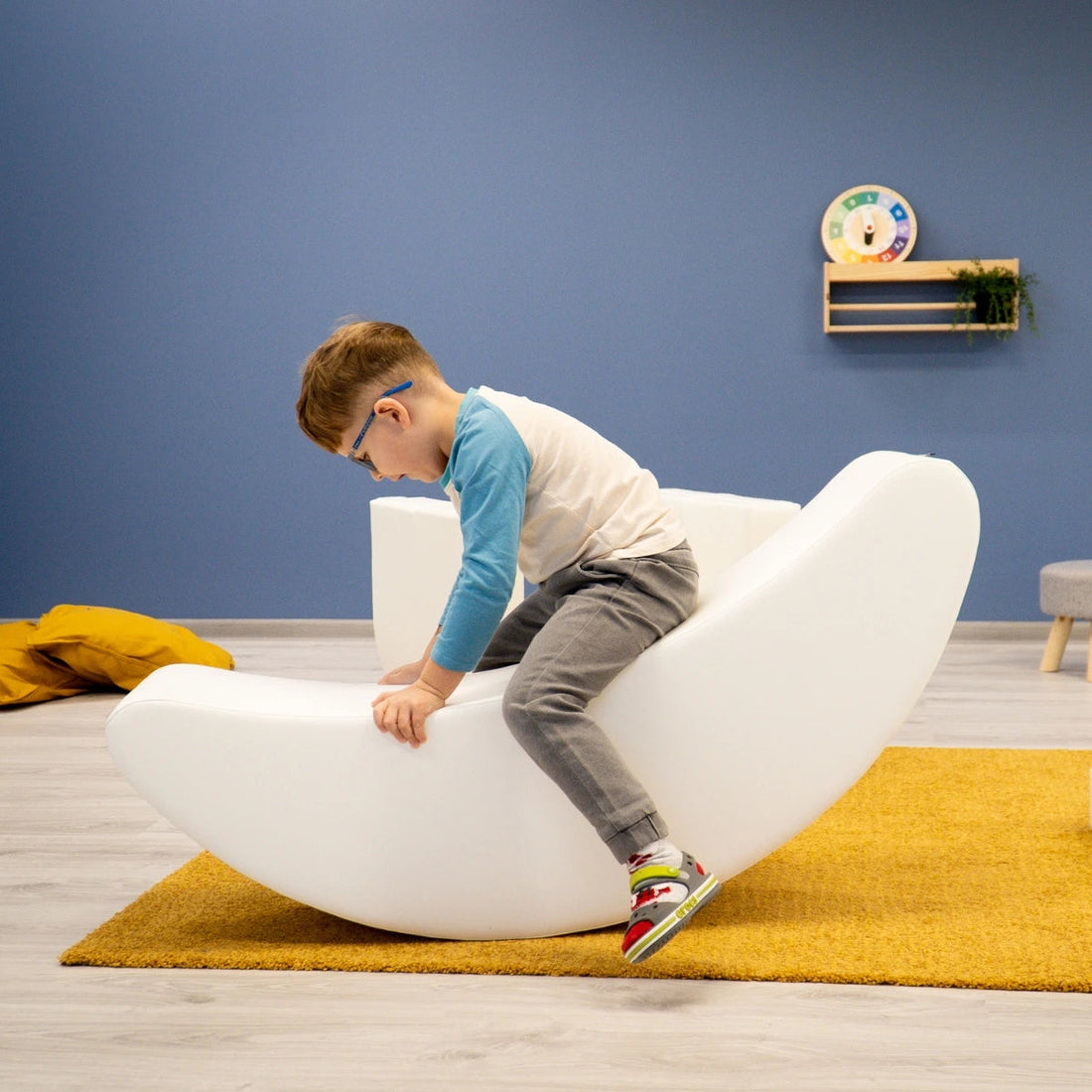 Blush Apricot furniture banana-shaped decorative piece in vibrant yellow, showcasing smooth, curved design on a neutral background.