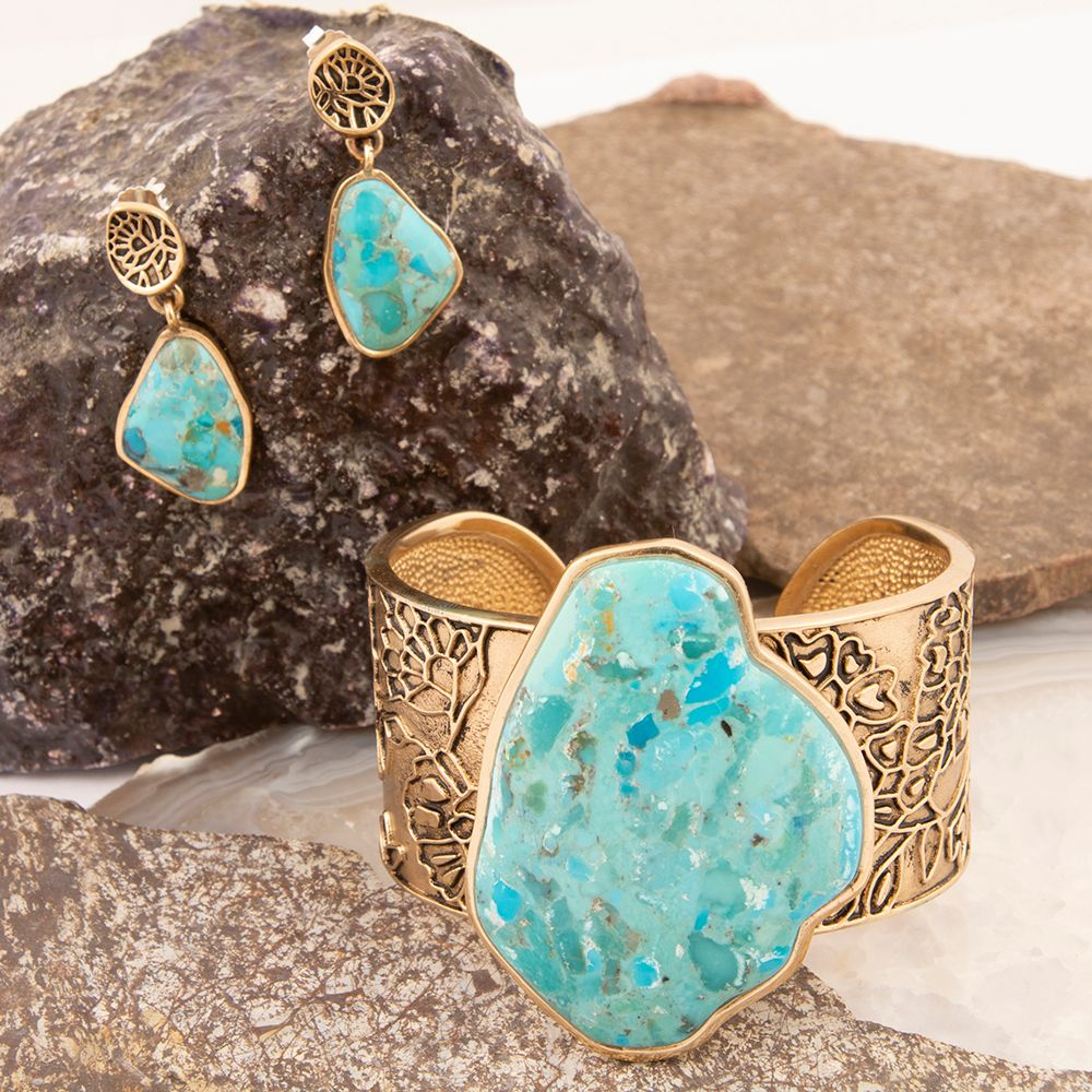 Thistle Blue Turquoise and Golden Cuff Bracelet by Start2Finish, featuring intricate jewelry design with blue and gold accents.