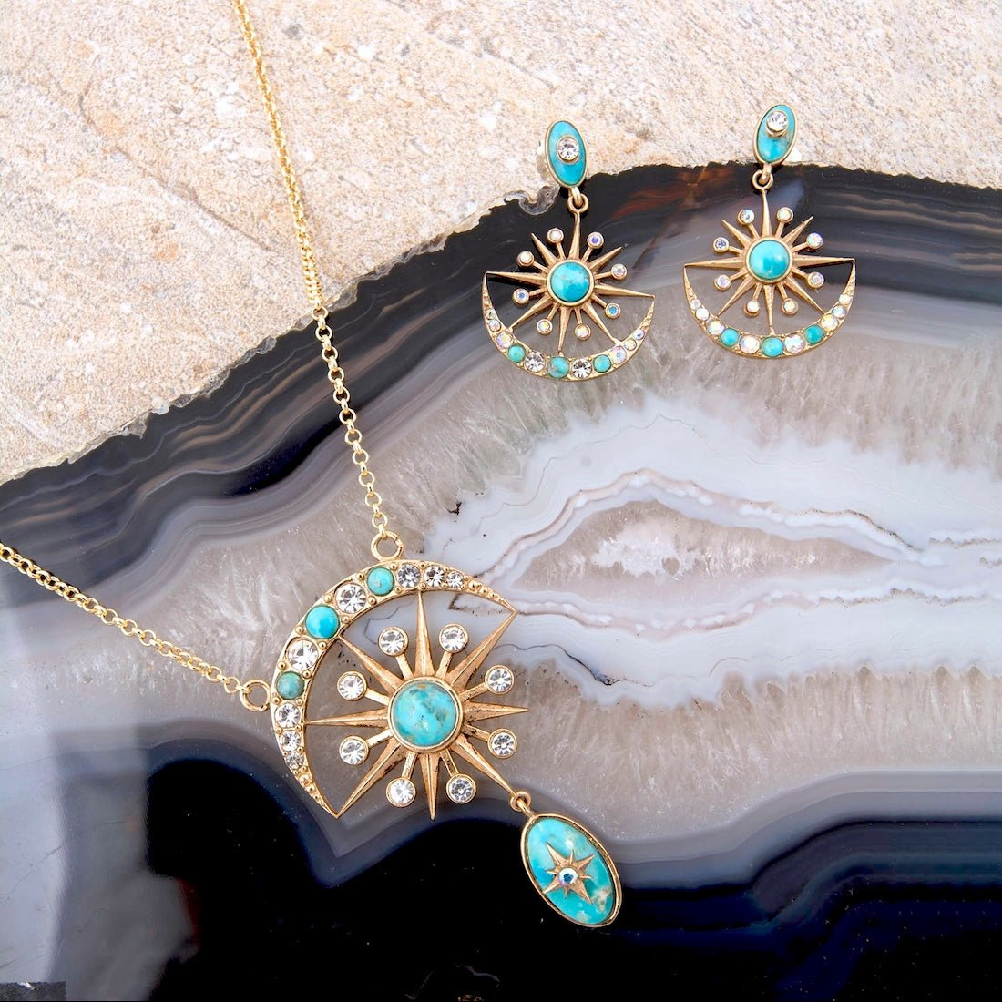 Celestial blue turquoise and gold drop necklace featuring a pendant with turquoise stones and elegant gold chain jewelry.