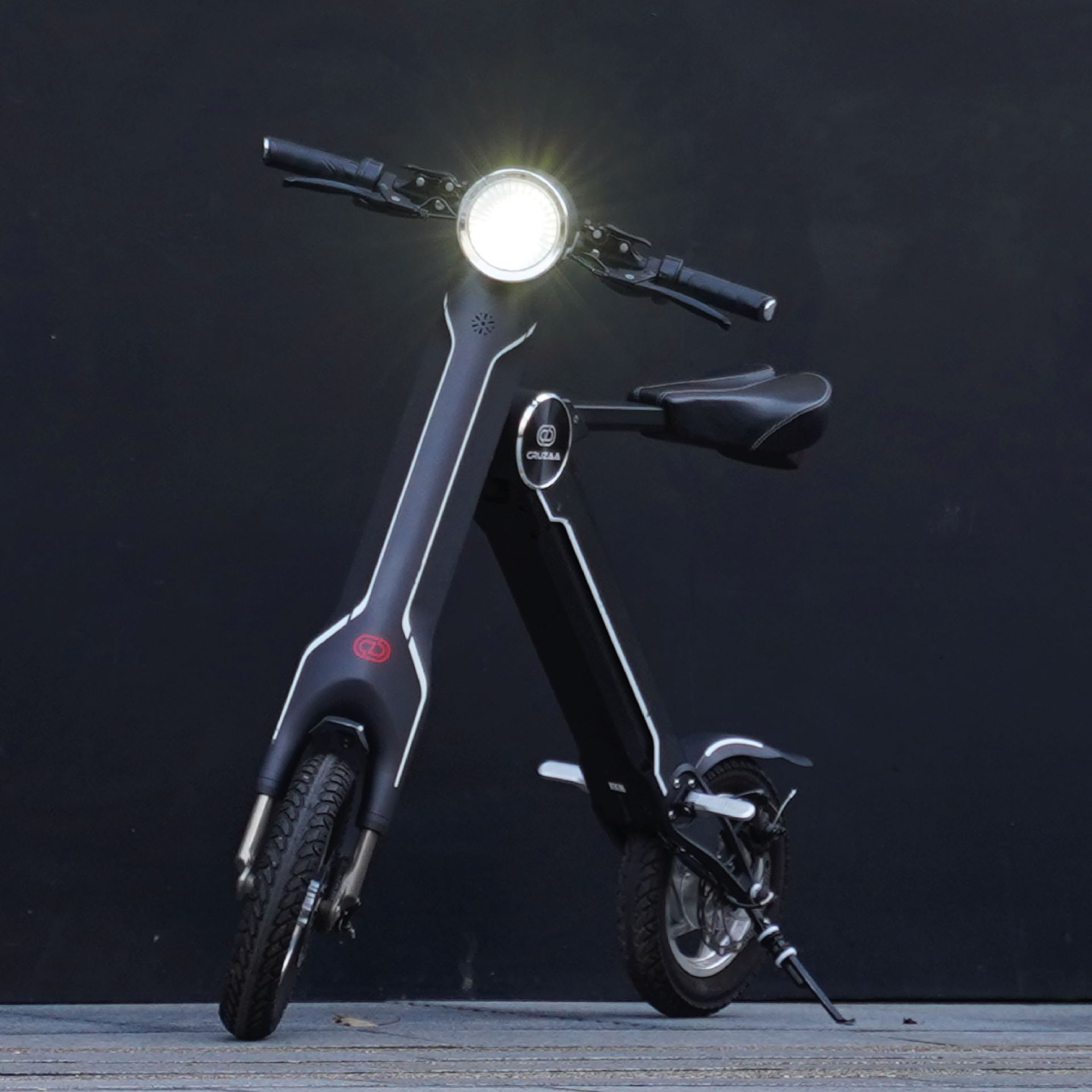 Cruzaa PRO electric scooter in carbon black with built-in Bluetooth speakers, USB port, 45km range, and 35km/h top speed.