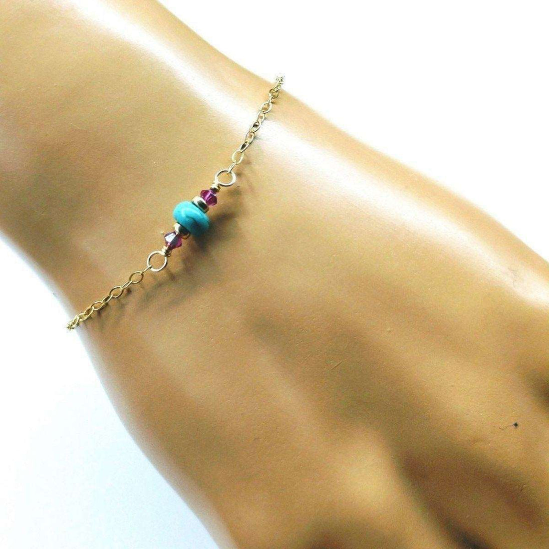 Dainty 14K gold-filled bracelet with pink and turquoise gemstones, featuring a delicate and elegant design from Blue Crius.