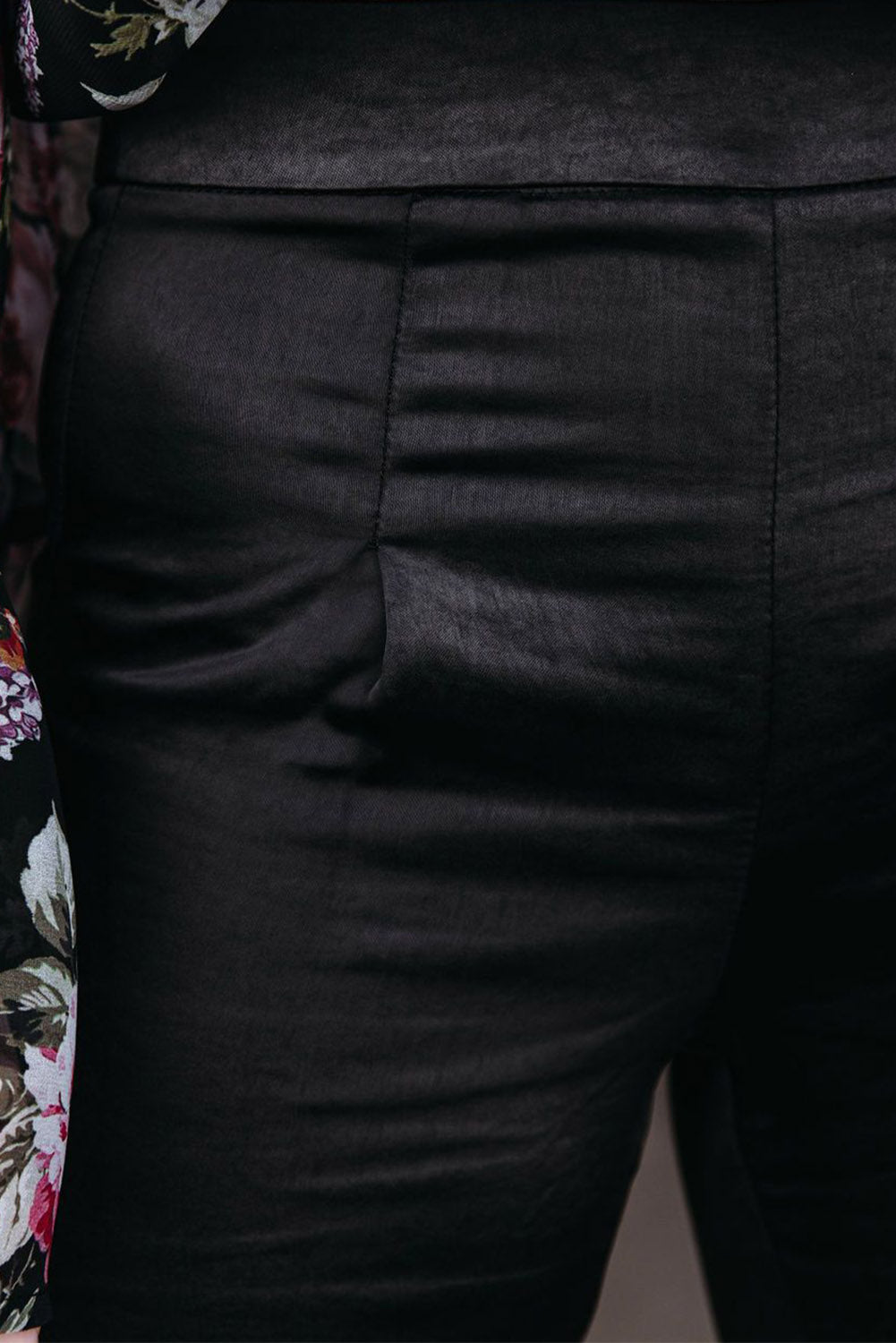 Black satin flare tailored pants by Harlequin Daisy, stylish and smooth fabric with a fitted waist and flared leg silhouette.