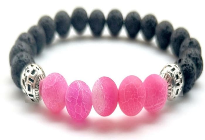 Pink lava stone essential oil bracelet by Start2Finish, featuring round pink lava beads in a stylish jewelry design.