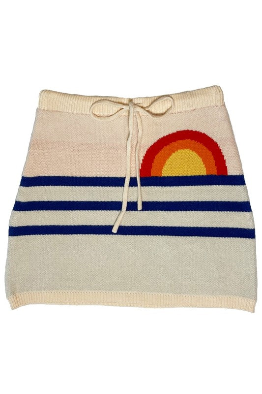 Jade Icarus Sunset knit skirt with vibrant sunset colors, showcasing a stylish, fitted knit design perfect for casual wear.