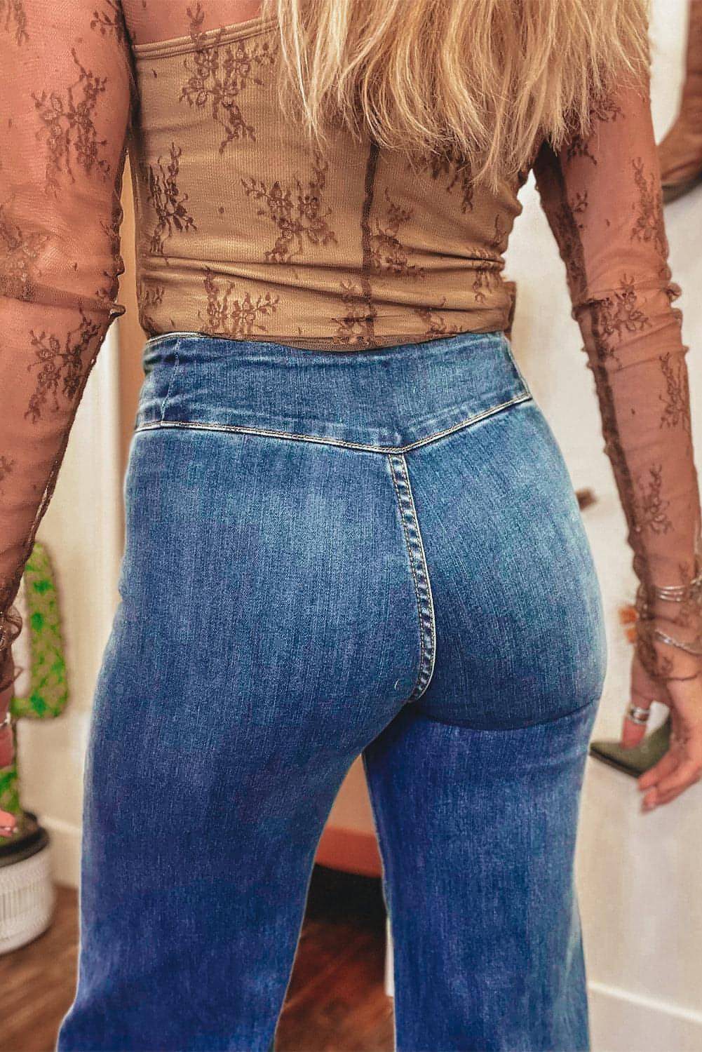 Carmine Juneberry Sail Blue high waist flare jeans with button fly, seamed details, and raw hem for a stylish denim look.