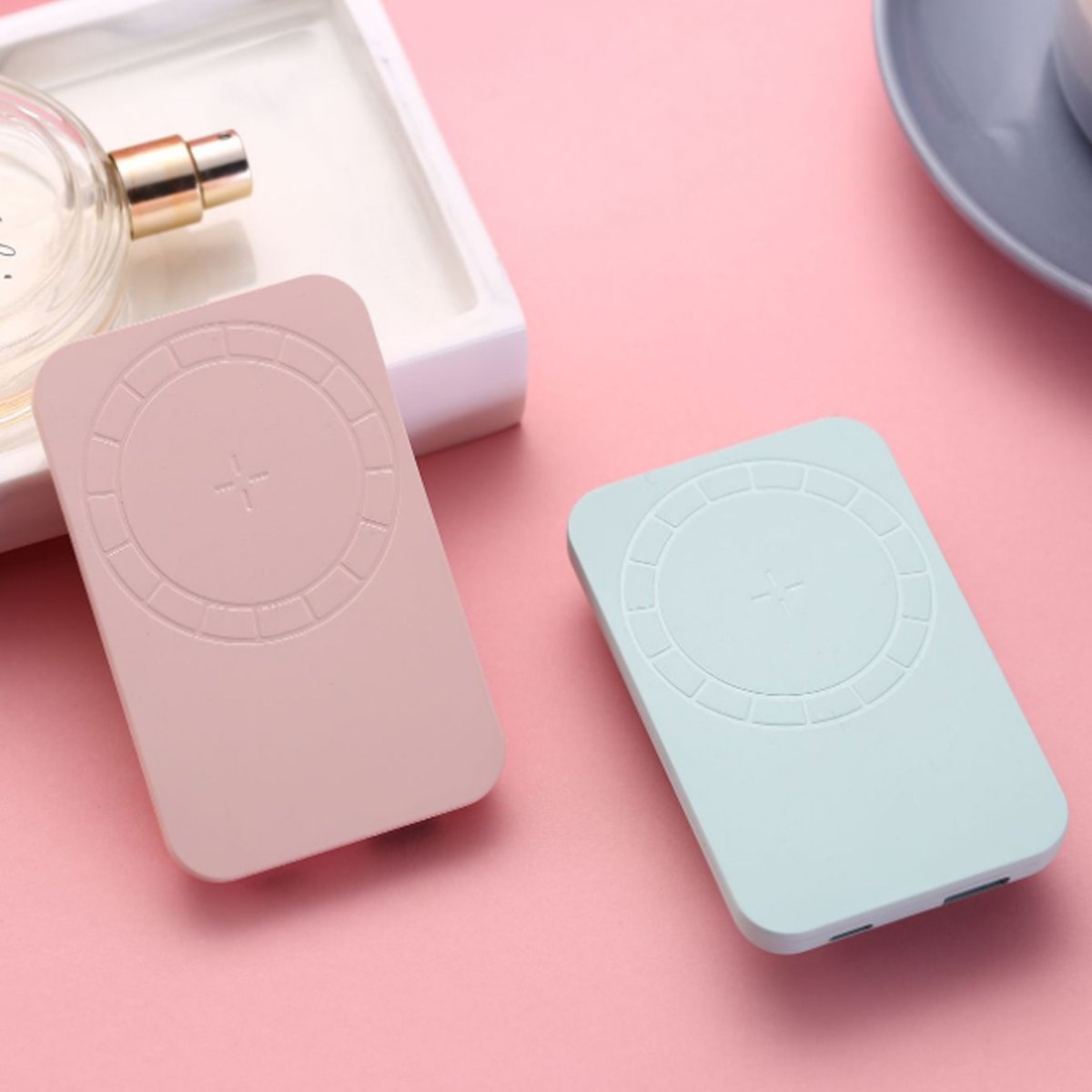 Salmon Lucky wireless magnetic charger and power bank for iPhone 12 with sleek black design and magnetic attachment.