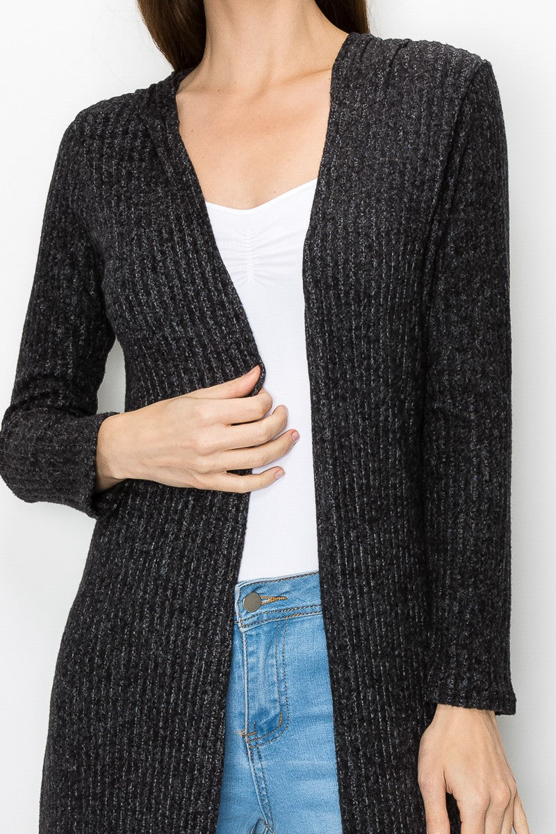 Black long sleeve hooded light cardigan dress by Yellow Hera, shown on a model with a relaxed fit and casual style.