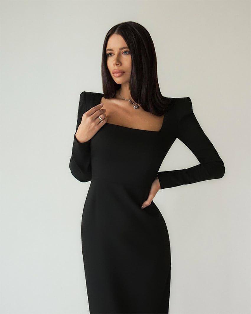 Carmine Juneberry long skirt with a square neckline and slim fit, shown in a stylish design with smooth fabric.