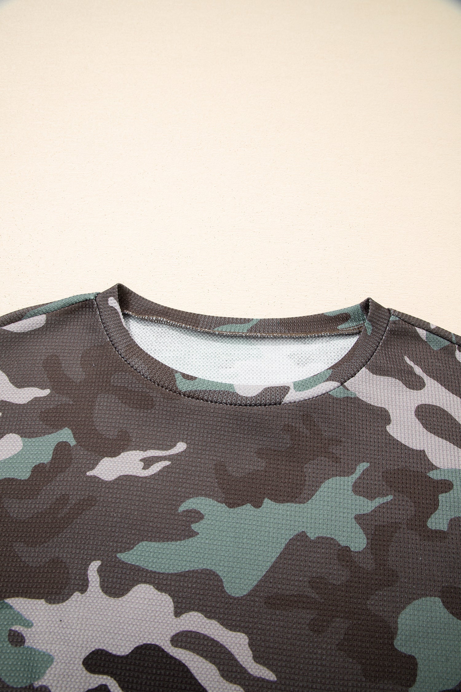 Camo textured drop shoulder long sleeve top by Byzantium Bay, showcasing a stylish camouflage design and relaxed fit.