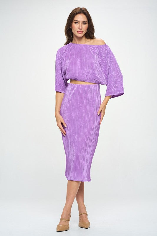 Vibrant plisse midi skirt from Jade Icarus, made in the USA, featuring colorful pleated fabric and a stylish, flowing design