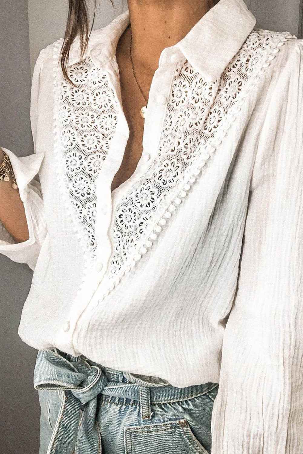 White floral lace hollow-out splicing crinkled blouse by Carmine Juneberry, featuring delicate lace details and stylish crinkled fabric.