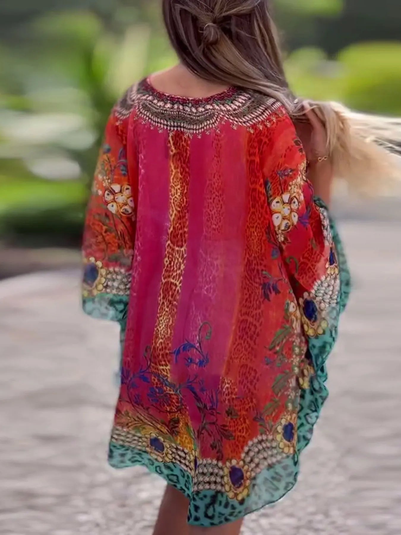 Floral print V-neck cover-up by Carmine Juneberry, lightweight and stylish for beach or poolside wear.