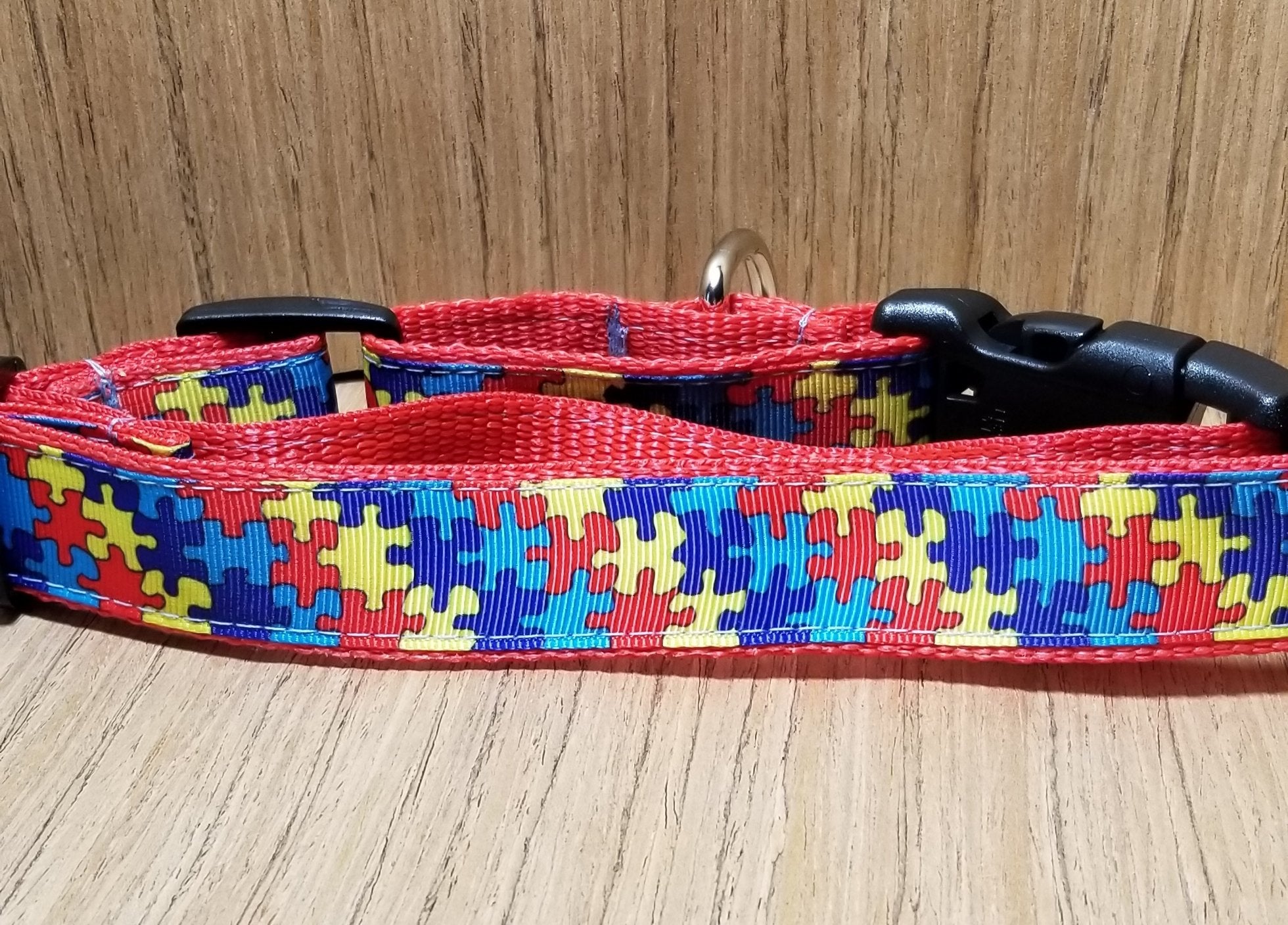 Large pet collar with autism puzzle piece design from Green Thalassa, featuring colorful puzzle patterns on durable petwear.