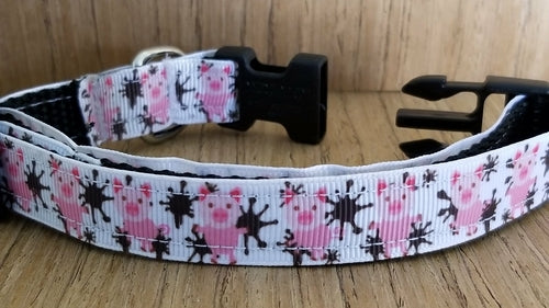 Green Thalassa small pig-themed collar with colorful "Pigs in the Mud" design, made for pets, featuring playful animal pattern.