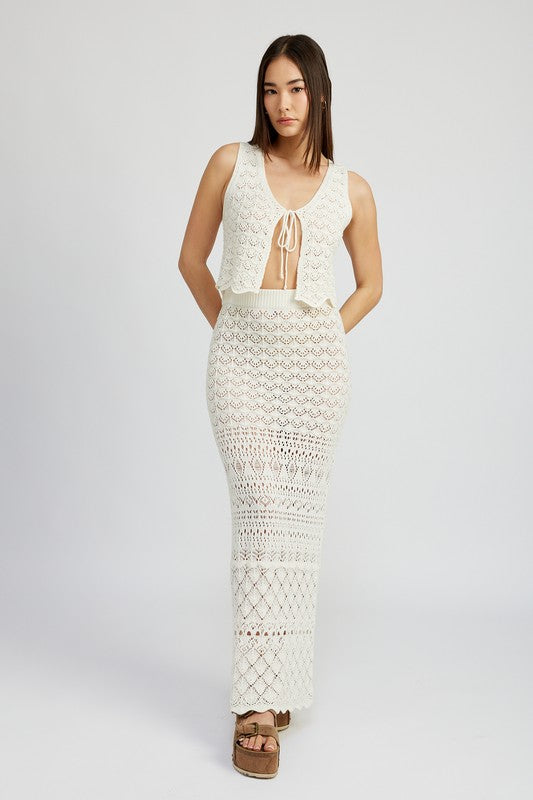 Automotive fitted crochet maxi skirt with slit by Jade Icarus, featuring detailed crochet fabric and a stylish slit design.