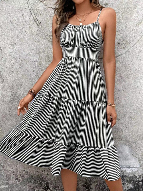 Striped spaghetti strap midi dress for women by Jade Icarus, featuring a fitted waist and below-the-knee length.