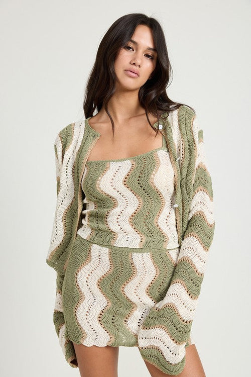 Jade Icarus crochet mini skirt with elastic waistband, featuring detailed knit pattern and fitted style.