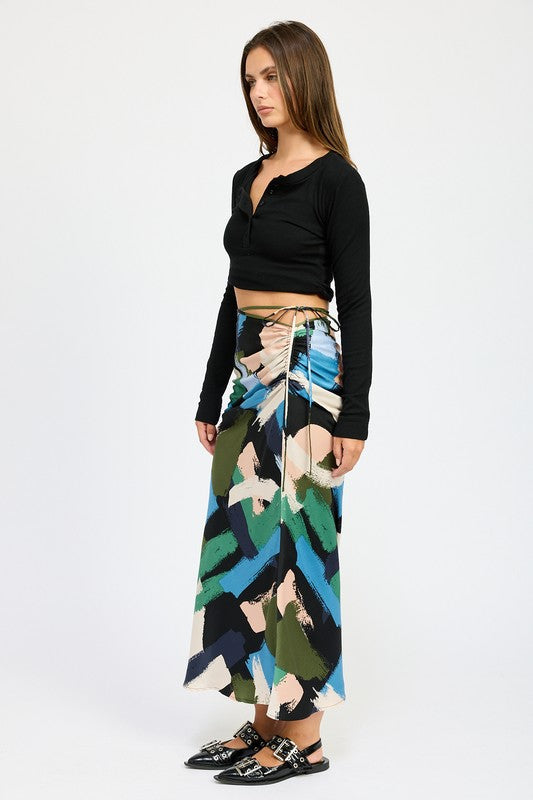 Automotive Jade Icarus side ruched midi skirt with detailed stitching and fabric texture, displayed on a mannequin.