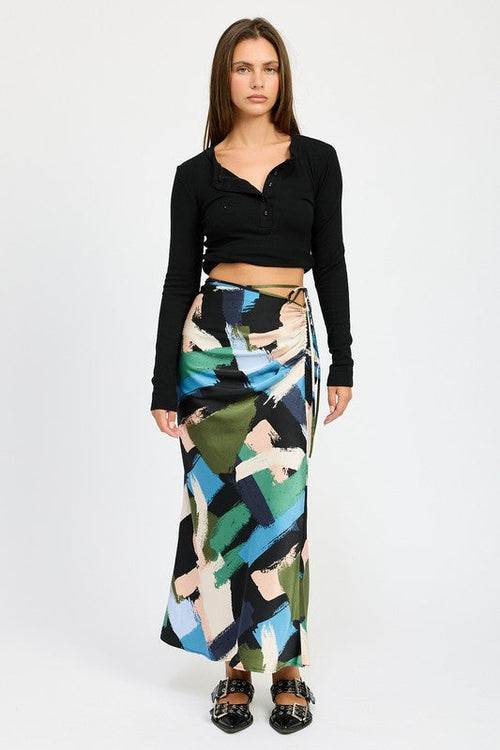 Side ruched midi skirt by Jade Icarus, featuring a sleek automotive-inspired design with detailed ruching and modern style.