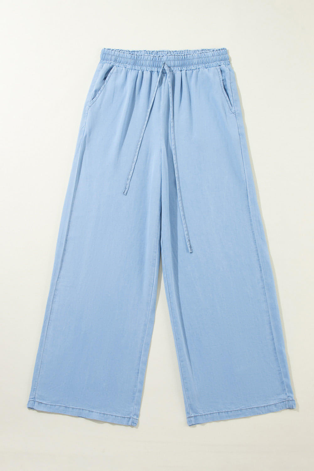 Carmine Juneberry Myosotis drawstring high waist wide-leg denim pants with relaxed fit and classic blue denim fabric.