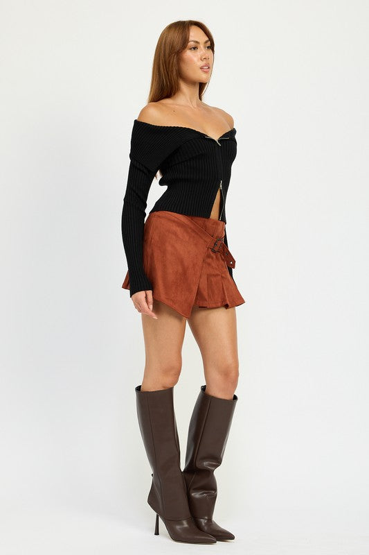 Jade Icarus wrapped buckle belt mini skirt in black fabric, featuring a stylish buckle detail and fitted silhouette.