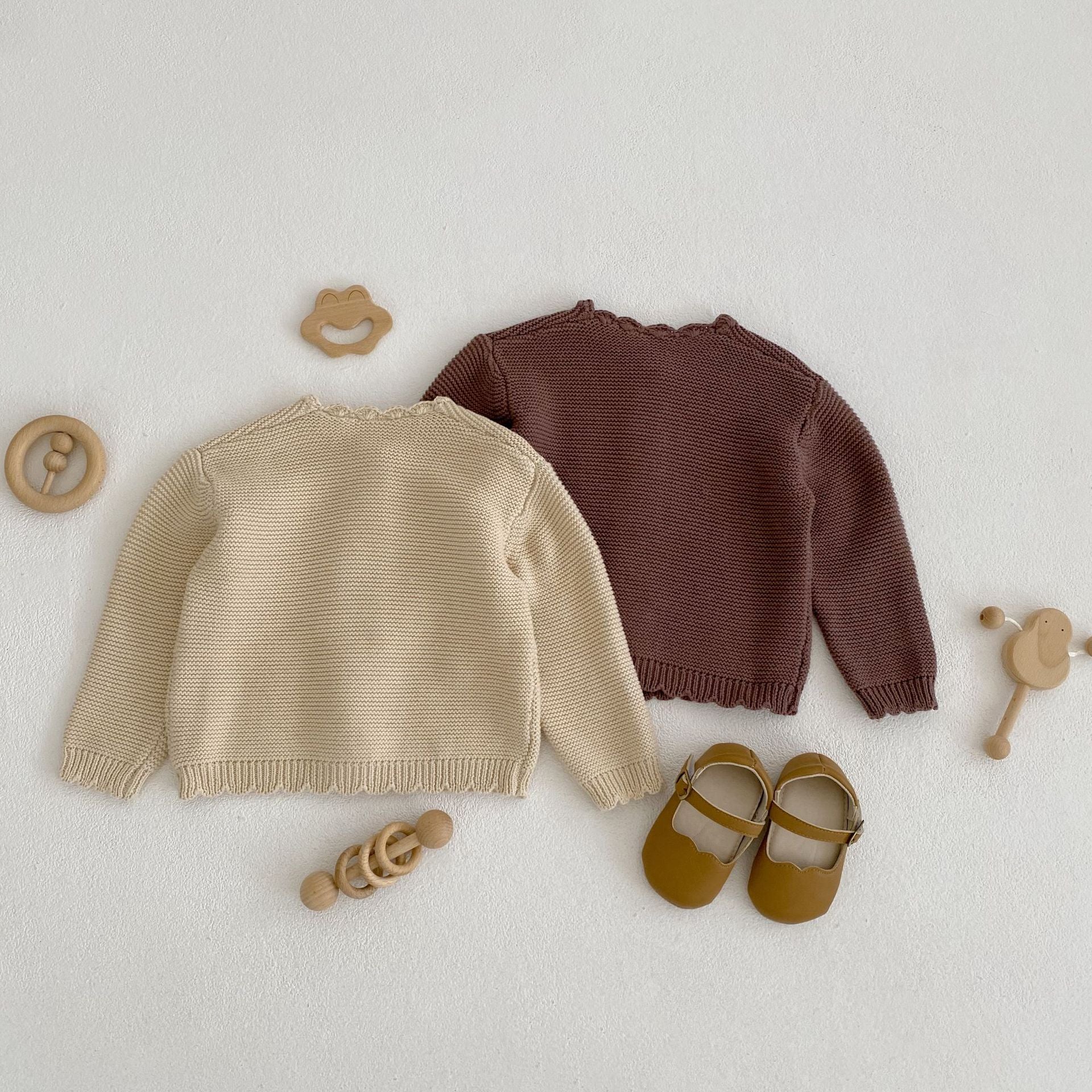 Baby unisex solid color crochet cardigan by Yellow Angel, soft knit baby clothing with button closure, in a cozy design.