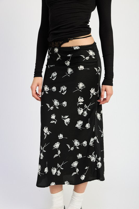 Jade Icarus mix media asymmetrical satin maxi skirt with flowing fabric and unique hemline, displayed on a model.