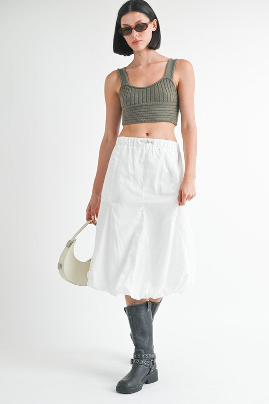 Automotive parachute bubble midi skirt by Jade Icarus with a shiny, voluminous fabric and bubble hem detail.