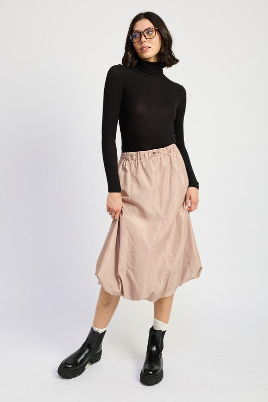 Jade Icarus parachute bubble midi skirt, automotive-inspired design with a shiny, textured fabric and unique silhouette.