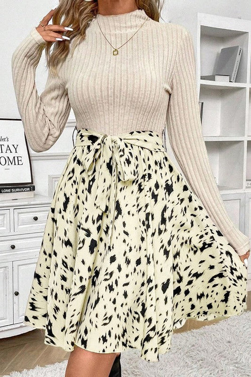 Women’s knit patchwork printed belted A-line dress by Jade Icarus, featuring a colorful pattern and a waist belt.