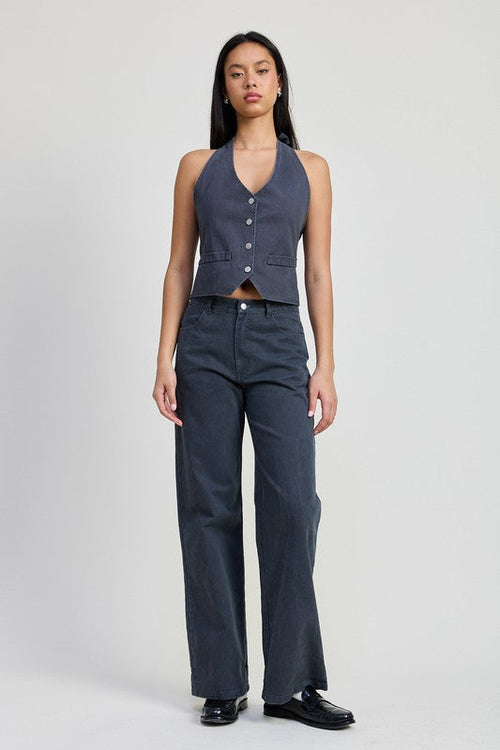 Fitted denim pants by Jade Icarus, folded and displayed, showcasing their stylish design and texture.
