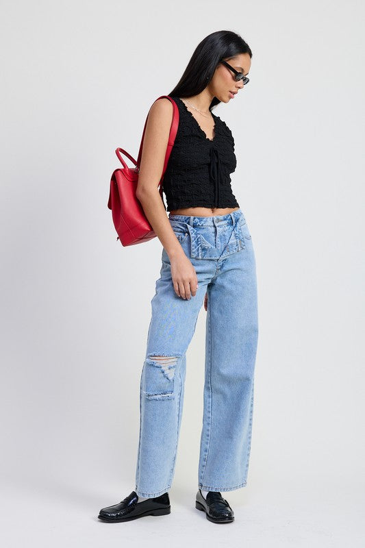 Jade Icarus layered straight leg denim pants featuring automotive-inspired design, visible stitching, and layered fabric details.