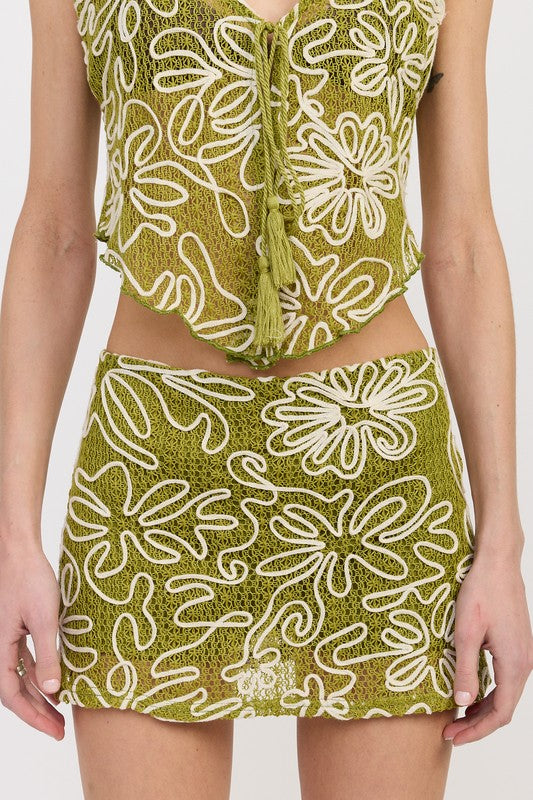 Automotive low rise printed mini skirt designed by Jade Icarus, featuring bold patterns and a sleek fit.