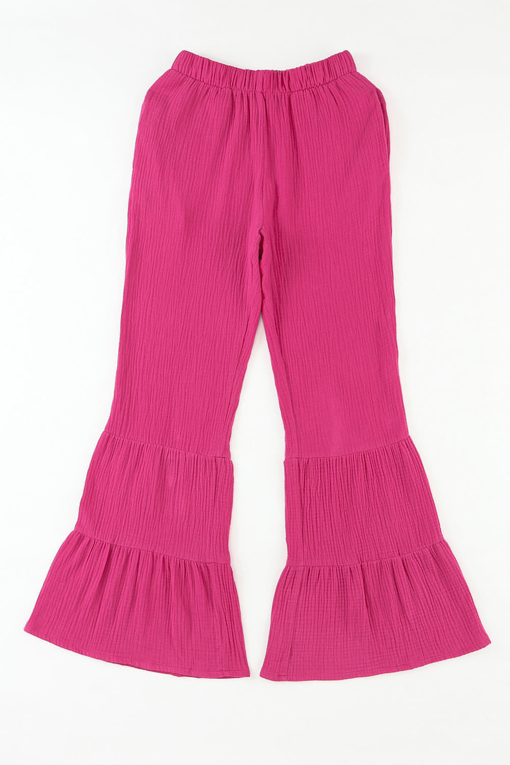 Rose textured high waist ruffled bell bottom pants by Carmine Juneberry, featuring a floral pattern and wide-leg silhouette.