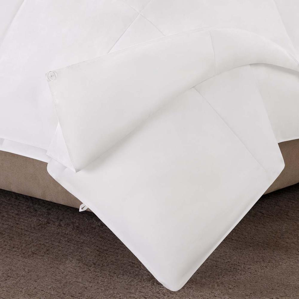 Start2Finish All Season 2-in-1 down alternative comforter on a bed, showcasing its plush, versatile bedding design.