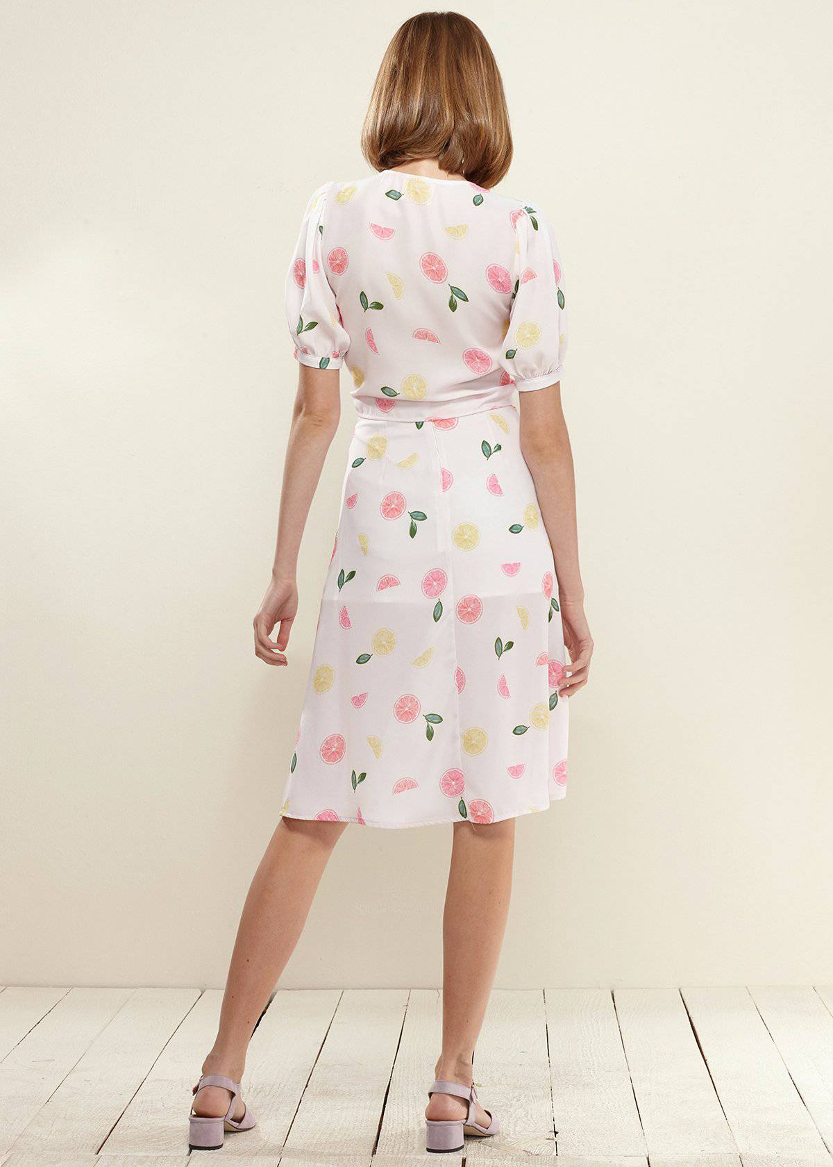 Lemon Hera button front midi skirt in vibrant fruit punch color, featuring a stylish design and midi length.