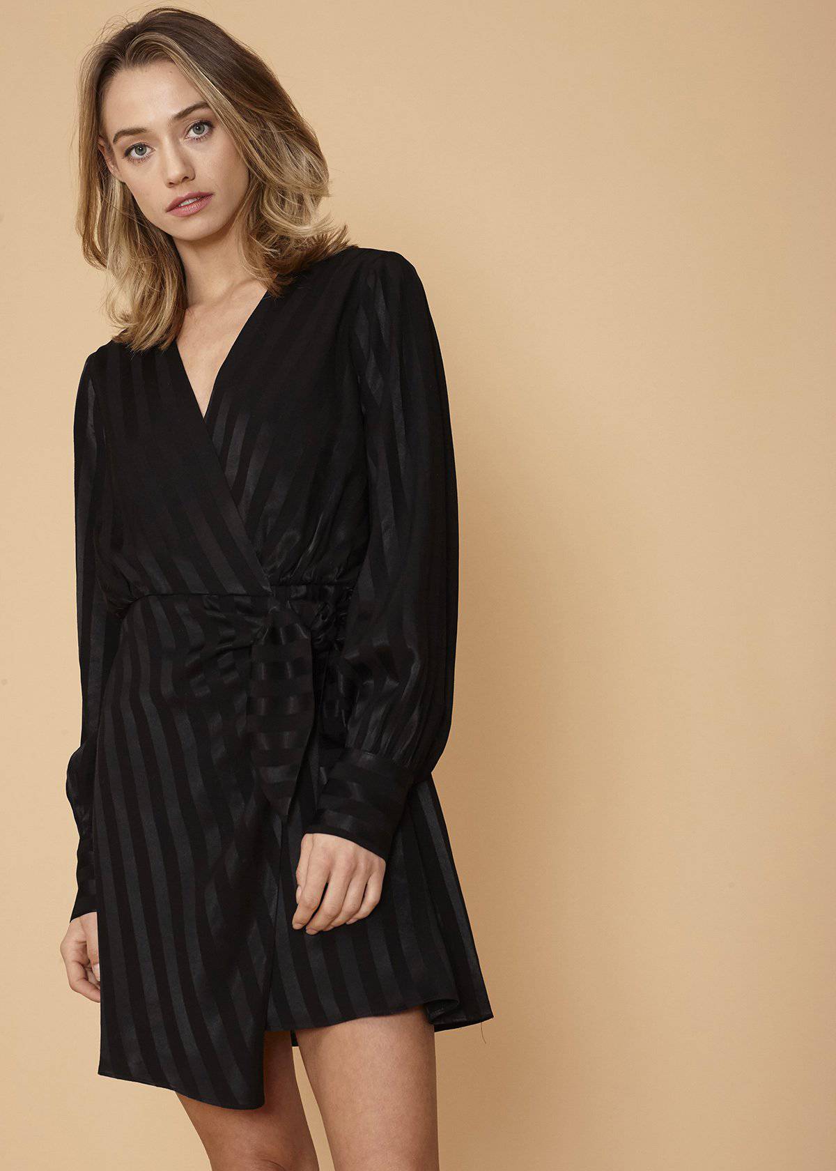 Black stripe satin long sleeve mini dress by Lemon Hera, showcasing a sleek, fitted design with long sleeves and elegant satin fabric.