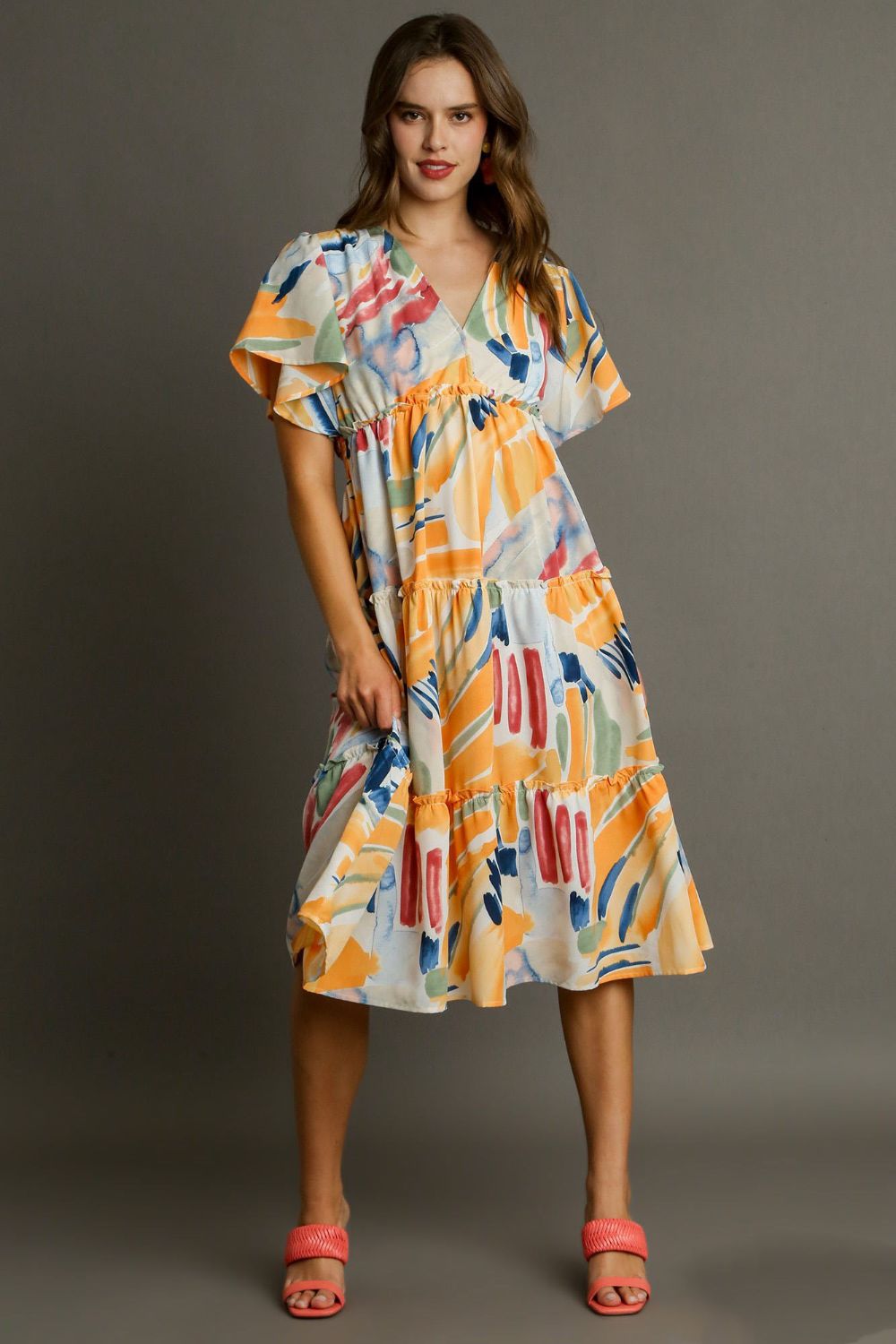 Colorful abstract print Umgee flutter sleeve frill tiered midi dress, featuring a flowing silhouette and tiered design.