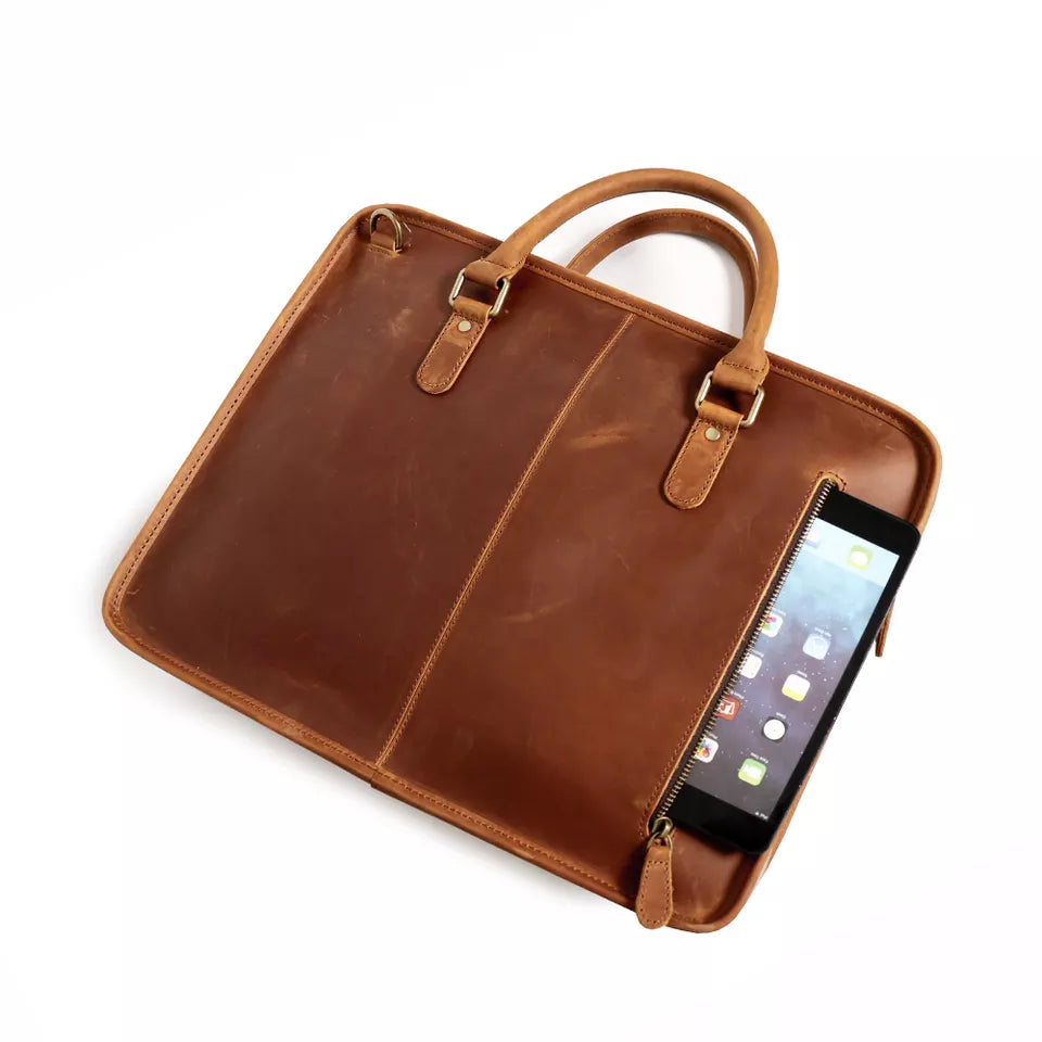 Hemming Leather Laptop Bag by Start2Finish, vintage leather briefcase with sturdy handle and sleek design for carrying laptops.